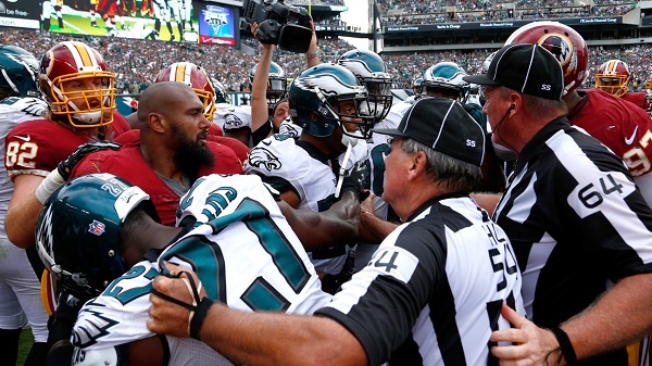 Officials try to break up a scuffle between the Washington Redskins and Philadelphia Eagles during the second half of an NFL football game, Sunday, Sept. 21, 2014, in Philadelphia. (AP Photo/Matt Rourke)