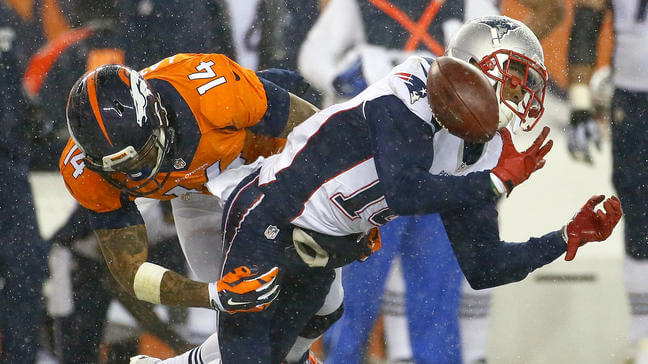 New England Patriots wide receiver Chris Harper (14) fumbles on a punt return as Denver Broncos wide receiver Cody Latimer (14) defends during the second half of an NFL football game, Sunday, Nov. 29, 2015, in Denver. The Broncos recovered the ball. (AP Photo/Jack Dempsey)